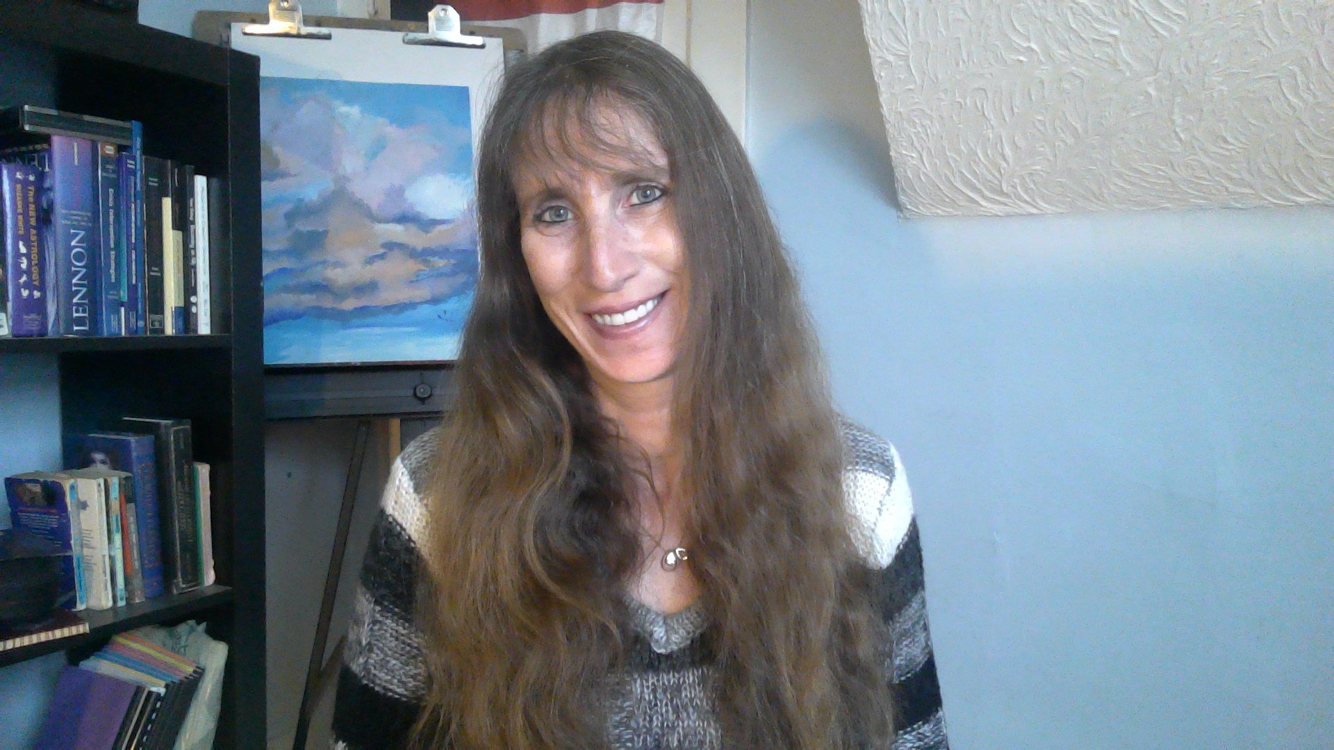 Person preparing focused questions for a psychic reading at home