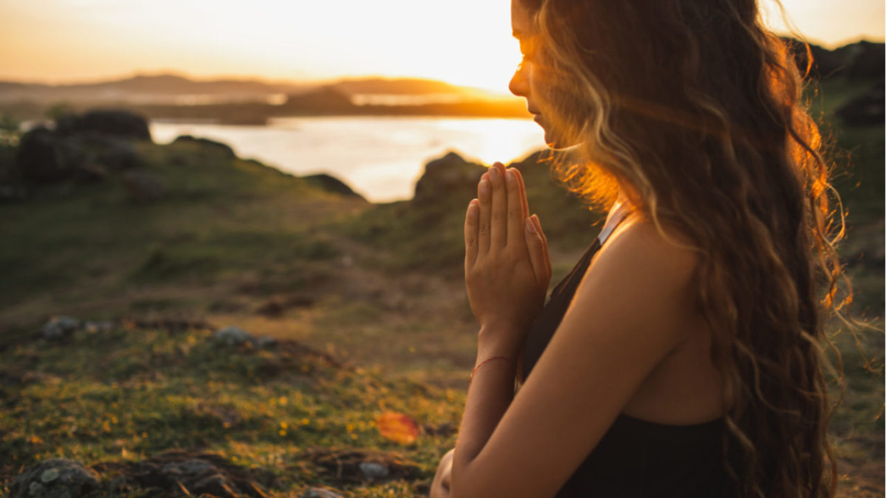 Person reflecting on possible spirit world messages in a simple home setting