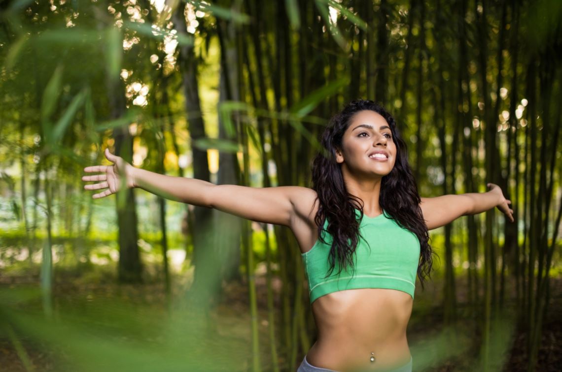 Person creating a smoke-free aura-cleansing ritual at home